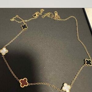 Gold Clover Necklace with Black, White, and Red Accents